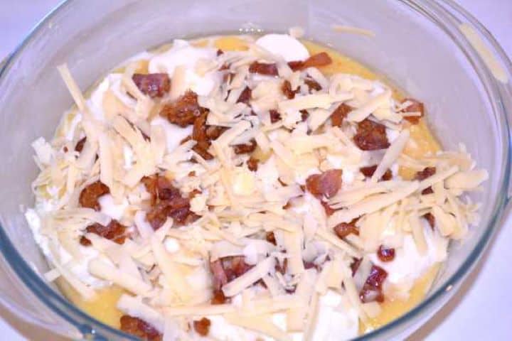 First Layer Bacon and Cheddar Crispy bacon pieces and grated cheddar cheese layered over mozzarella and polenta.