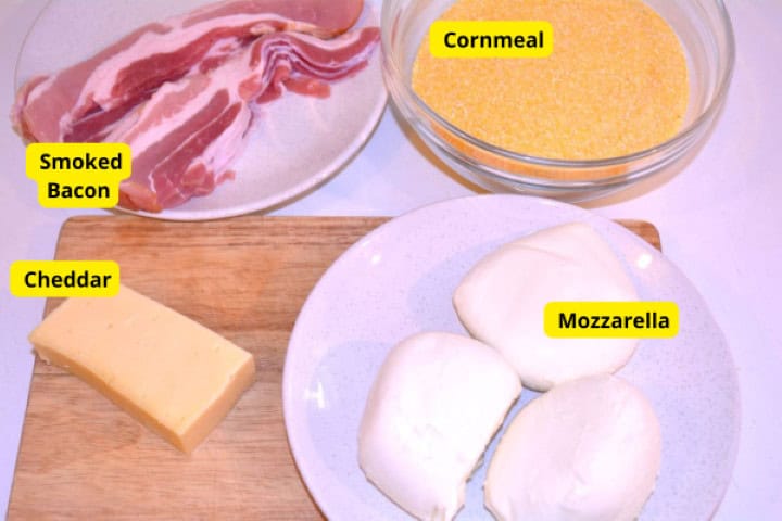 Ingredients Ingredients for baked cheesy polenta: coarse cornmeal, fresh mozzarella balls, smoked bacon, and cheddar cheese.