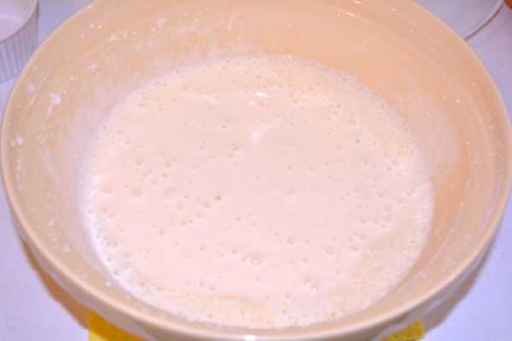 Batter Adding thick full-fat Greek yoghurt and cornstarch into a mixing bowl to create a smooth, lump-free cake batter.