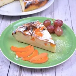 Gluten-Free Yoghurt Cake-Cake Slice Served on Plate With Apricot Slices and Grapes