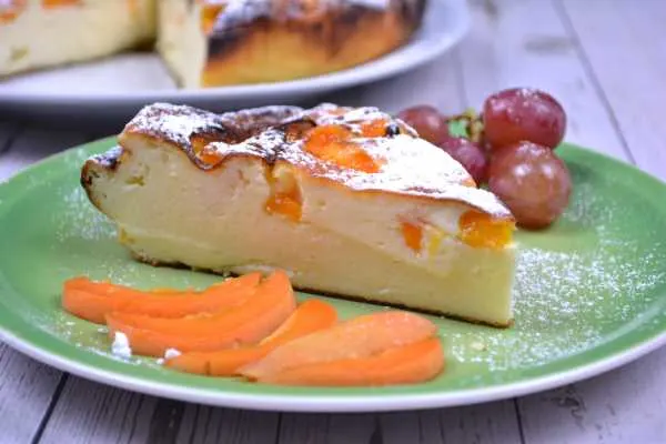 Gluten-Free Yoghurt Cake-Cake Slice Served on Plate With Apricot Slices and Grapes
