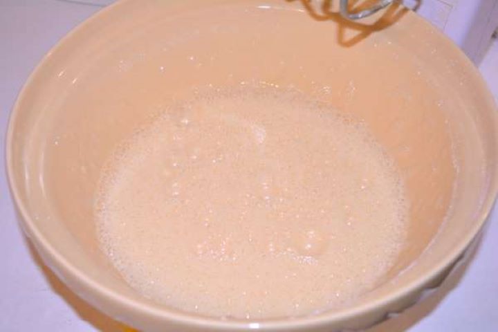 Mixed Eggs Whisking eggs and sugar in a glass bowl until pale and frothy for an easy gluten-free dessert base.