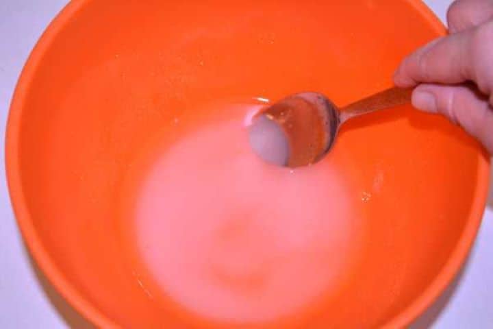 Sweet Vinegar Whisking sugar, vinegar, and warm water in a bowl to make traditional Hungarian salad brine.