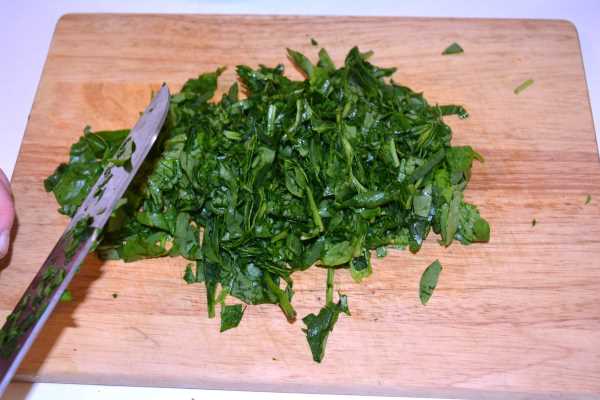 Spinach and Feta Rolls-Chopping Spinach on the Chopping Board