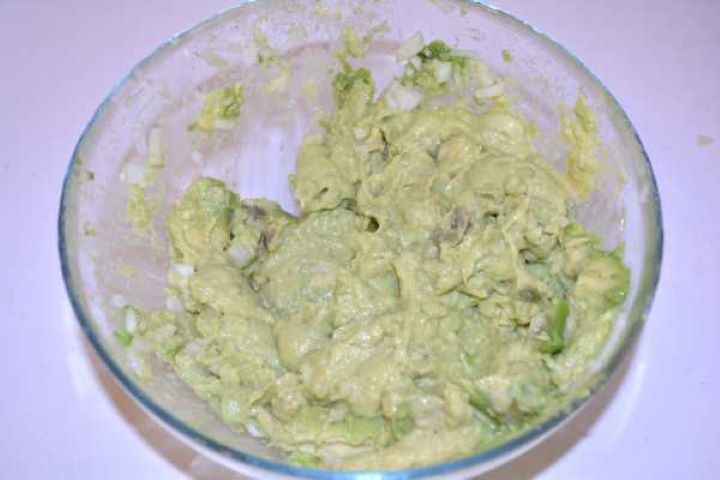 Mash Avocado and onion pulsed into a coarse, creamy paste with an immersion blender.