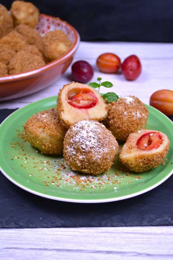 Hungarian Plum Dumplings-Served on the Green Plate With Sugar on Top