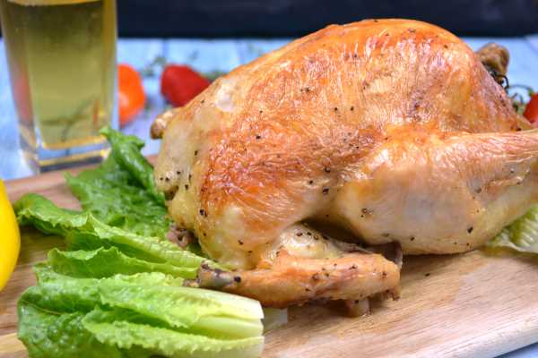 Roasted Free-Range Chicken-Served on Chopping Board With Lettuce Leaves