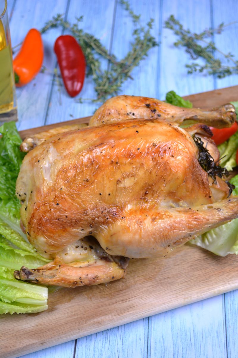 Roasted Free Range Chicken-Served on Chopping Board With Lettuce Leaves
