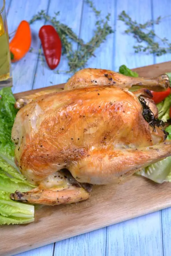 Roasted Free-Range Chicken-Served on Chopping Board With Lettuce Leaves, Peppers and Cherry Tomatoes