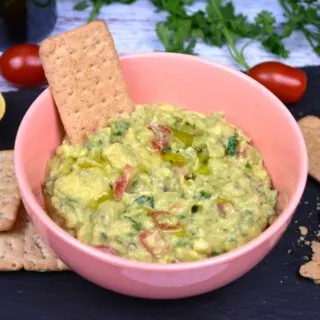 Vegan Guacamole-Served in Pink Bowl With Crackers