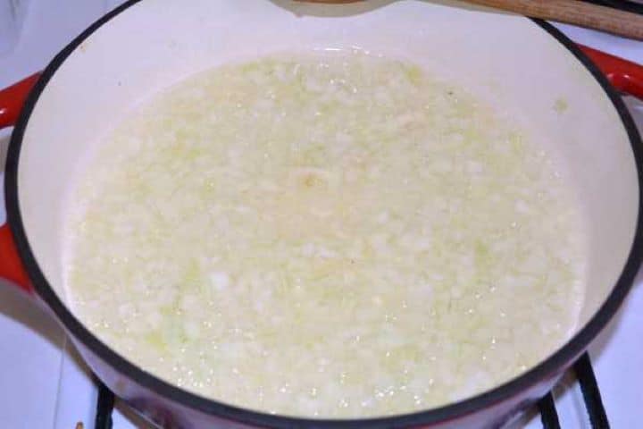 Onion Sautéing finely chopped onions in hot oil in a cast iron Dutch oven.