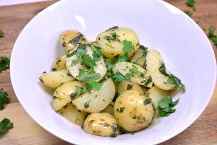 Served Hungarian Parsley Potatoes Served in the White Bowl With More Chopped Parsley on Top