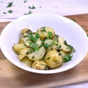 A bowl of Hungarian parsley potatoes made with baby potatoes and fresh herbs.