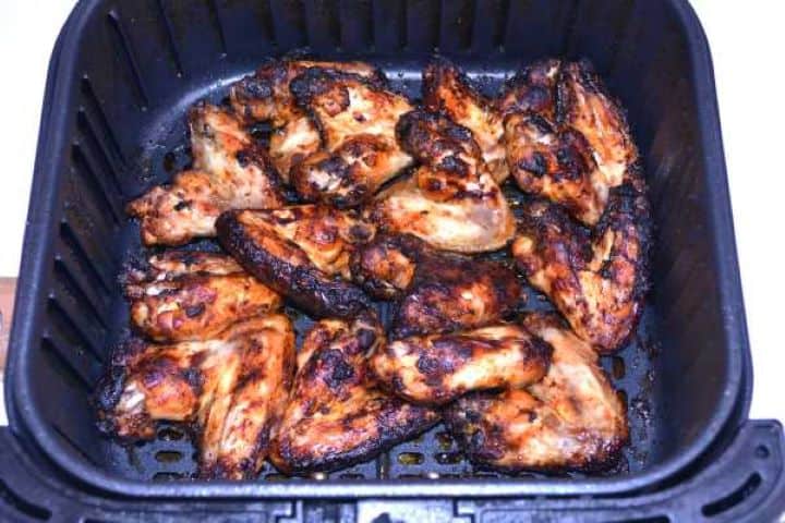Ready Crispy caramelized honey garlic chicken wings cooked to perfection in the air fryer basket.