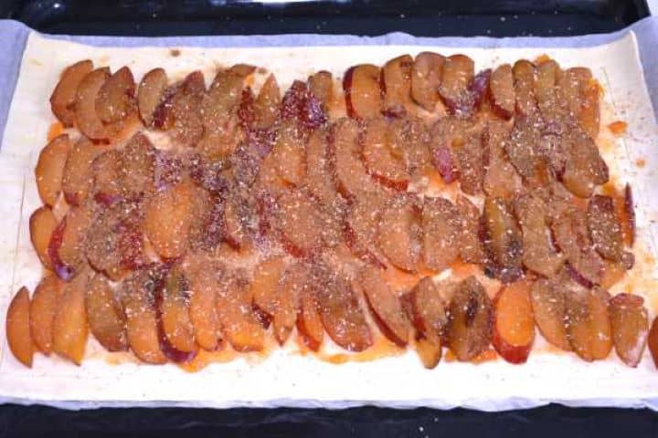 Sugar Sprinkled Brown sugar, cinnamon, and nutmeg sprinkled over sliced plums before baking the tart.