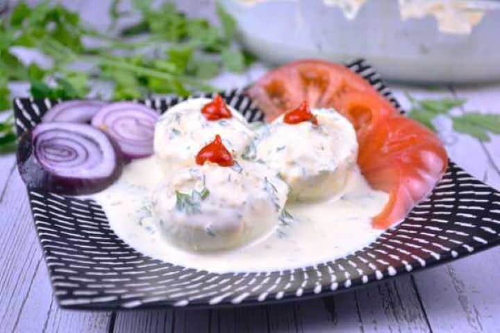 Serve Easy Transylvanian deviled eggs without vinegar garnished with dill and served as a holiday party appetizer.
