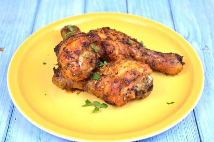 Serve Juicy and extra crispy air fryer chicken drumsticks served as an easy 40-minute weeknight dinner.
