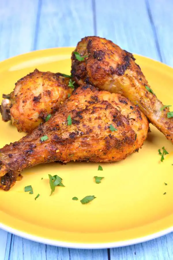 Air Fryer Chicken Drumsticks-Fried Chicken Drumsticks Served on Yellow Plate With Parsley on Top