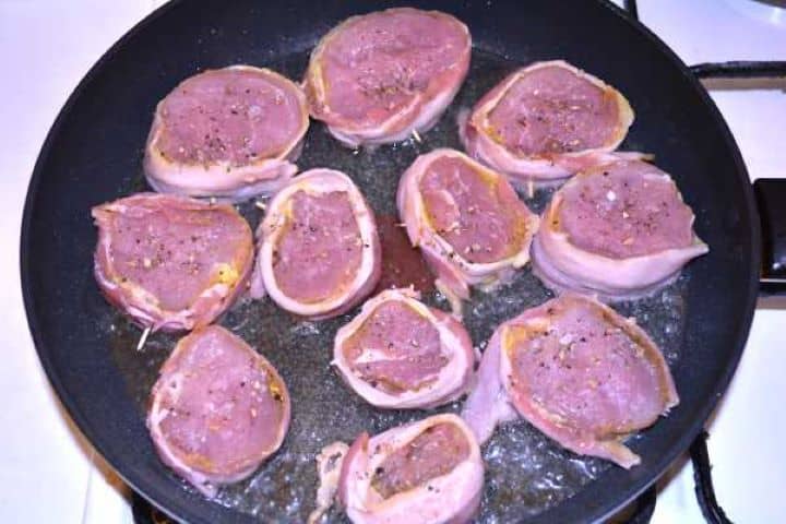 Fry Searing bacon-wrapped pork medallions in a hot skillet to render the bacon.