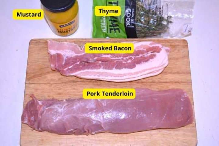 Ingredients Ingredients for pork medallions: trimmed pork tenderloin, smoked bacon rashers, English mustard, and fresh thyme.
