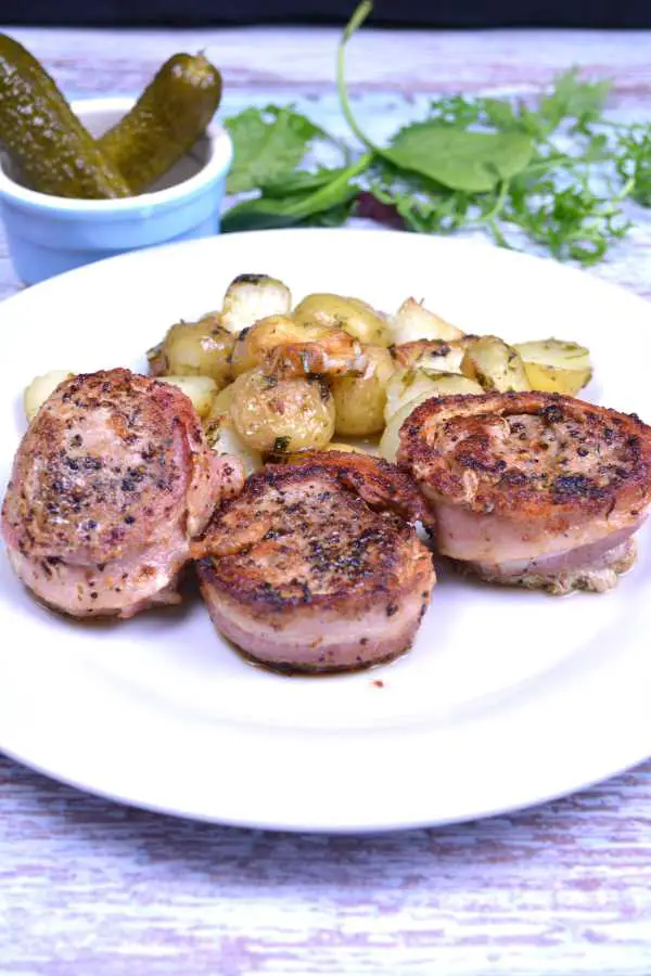 Bacon Wrapped Pork Medallions-Served on White Plate With Parsley Baby Potatoes