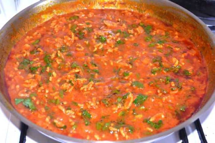 Sauteed Folding freshly chopped flat-leaf parsley into the simmering Turkish moussaka meat sauce.