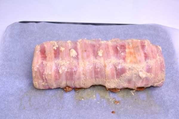 Bacon-Wrapped Turkey Meatloaf-Half Baked Turned Over in the Oven Dish