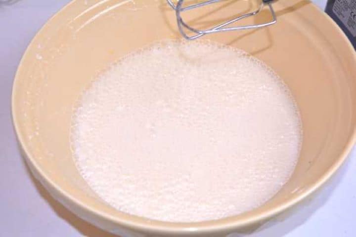Whisked egg mixture combined with melted butter, whole milk, and vanilla extract.