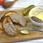 Turkey Liver Pate Spread on Toasts and Served on Chopping Board