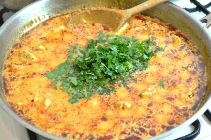 Stirring fresh finely chopped parsley into the creamy turkey stew just before turning off the heat.