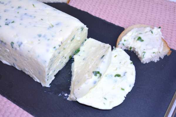 Herbed Cream Cheese-Sliced and Served on Black Tray With Bread