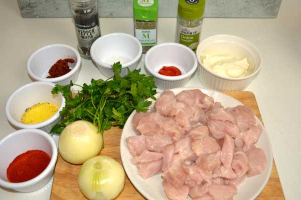 Turkey Paprikash Recipe-Turkey Meat, Onions, Parsley and Spices on the Chopping Board