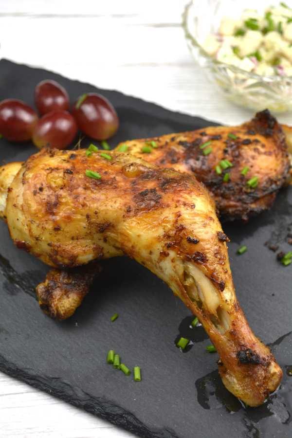 Air Fryer Chicken Legs-Served on Slate Platter With Grapes