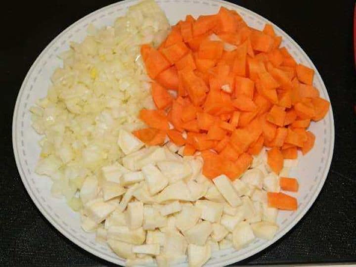 Chopped and Cut Onion, Carrots and Parsley on the Plate