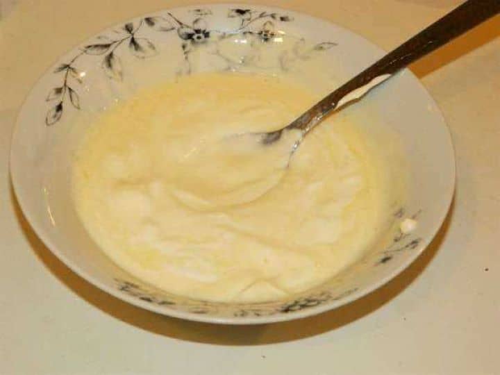 Mixed Egg Yolks, Sour Cream and Lemon Juice in a Bowl