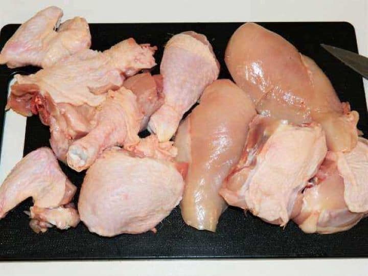 Portioned Chicken on the Chopping Board