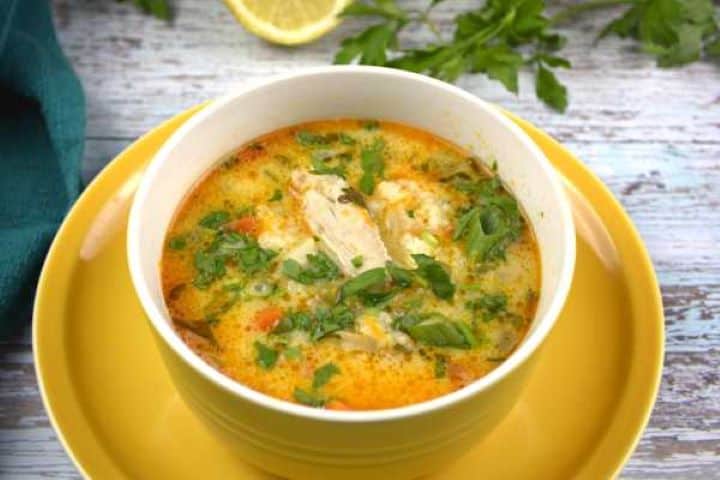Greek Style Lemon Chicken Soup Served in Yellow Bowl