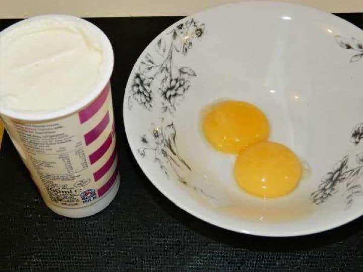 Sour Cream and Egg Yolks in a Bowl