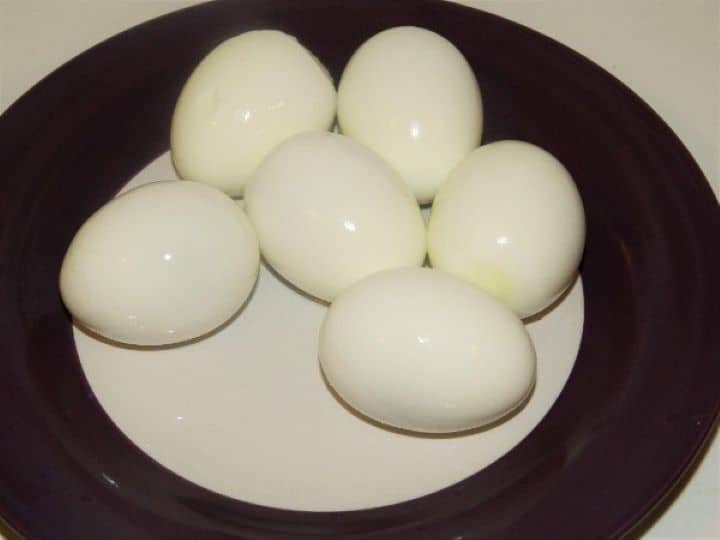Hard Boiled Eggs Six Hard Boiled and Peeled Eggs on the Plate