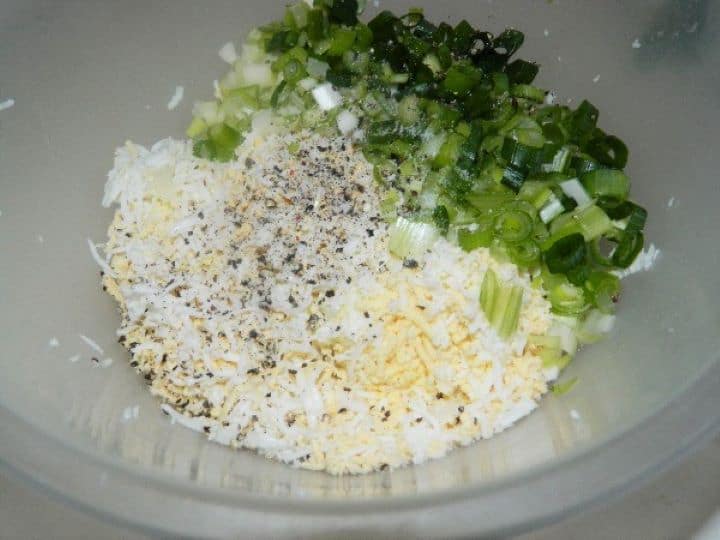 Seasoned grated eggs Seasoned Grated Eggs and Chopped Spring Onions in the Bowl