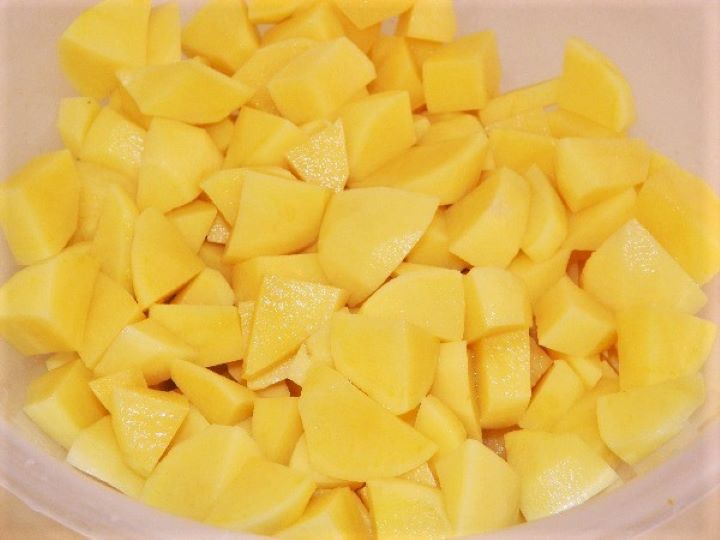 Cutted potatoes Cut in Cubes Potatoes in the Bowl