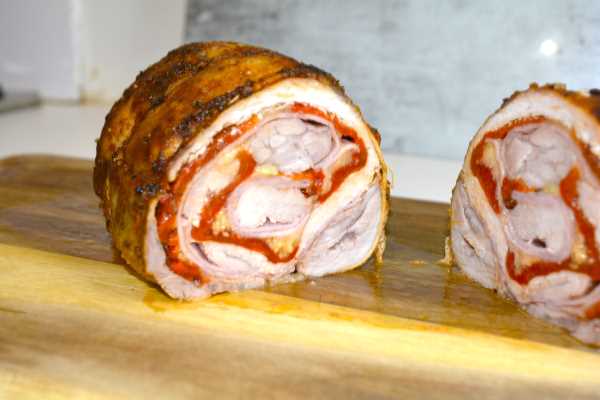 Ham and Cheese Stuffed Pork Loin-Stuffed Pork Loin Slice on the Chopping Board