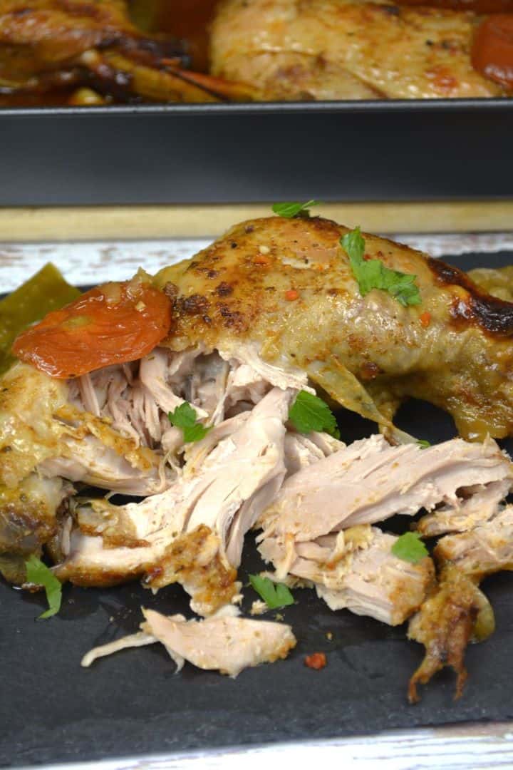 serving A serving of juicy, fall off the bone slow roasted turkey leg on a platter.