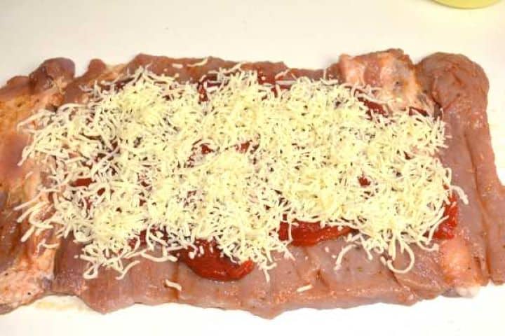 Roasted peppers and grated mozzarella on the pork loin.