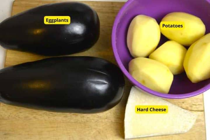 Eggplants, Potatoes and Cheese on the Chopping Board