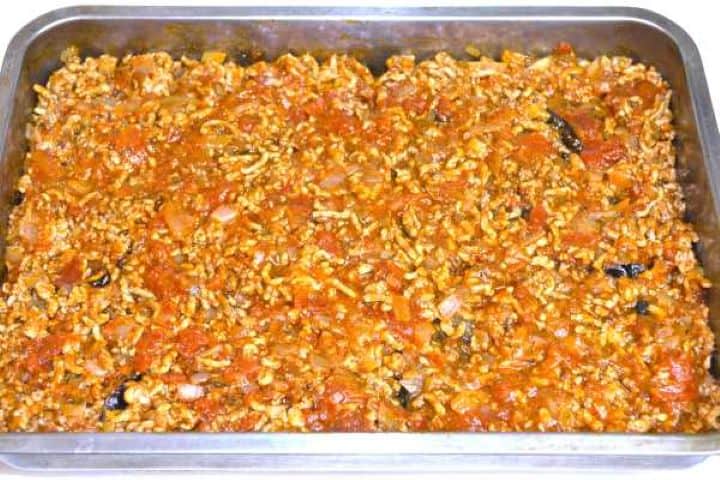 Meat Ragout Over Roasted Eggplant Slices in the Baking Tray