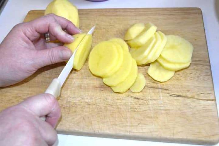 Slicing Potatoes on the Chopping Board