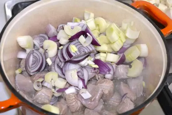 Turkey Spread-Sliced Onions on Frying Turkey Meat in the Pot