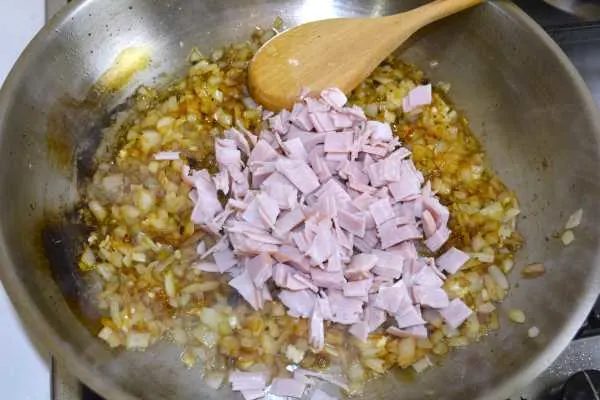 Cheesy Pork Chops-Frying Onions and Ham in the Pan