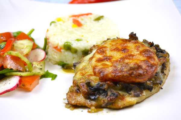 Cheesy Pork Chops-Served on Plate With Rice